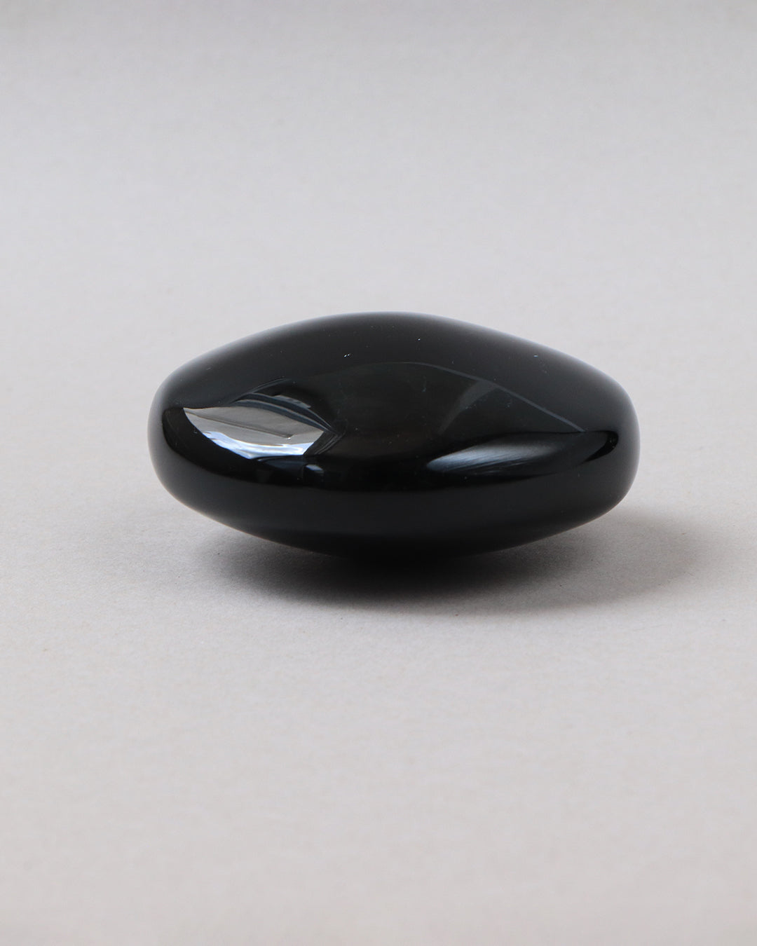 Masajeador de obsidiana luneta