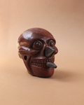 Craneo azteca con cuchillos rojo