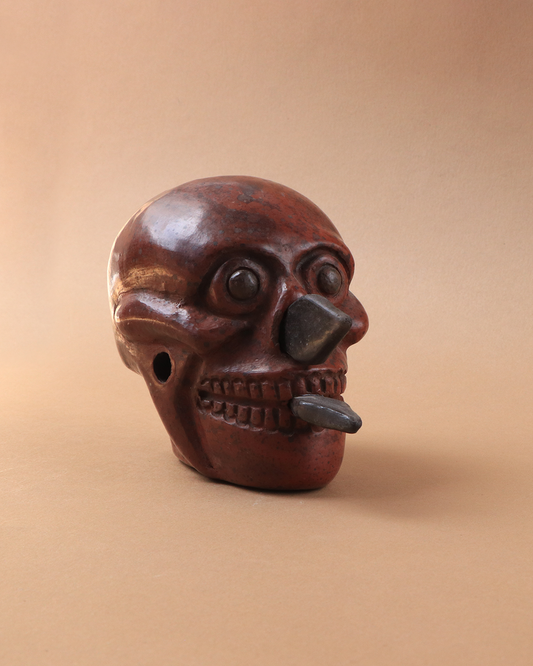 Craneo azteca con cuchillos rojo