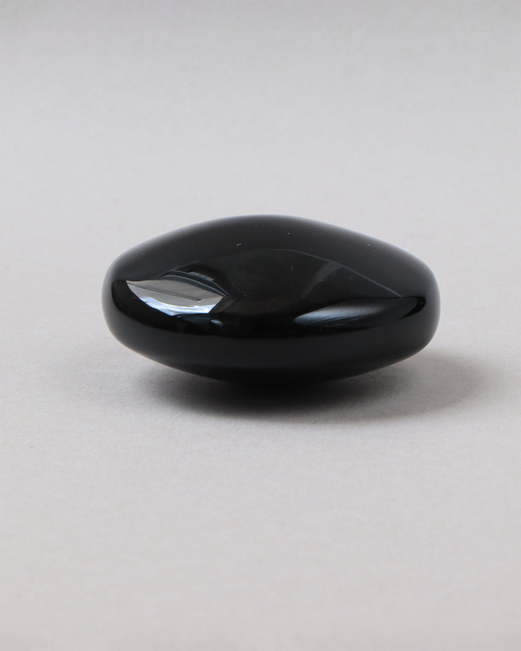 Masajeador de obsidiana luneta