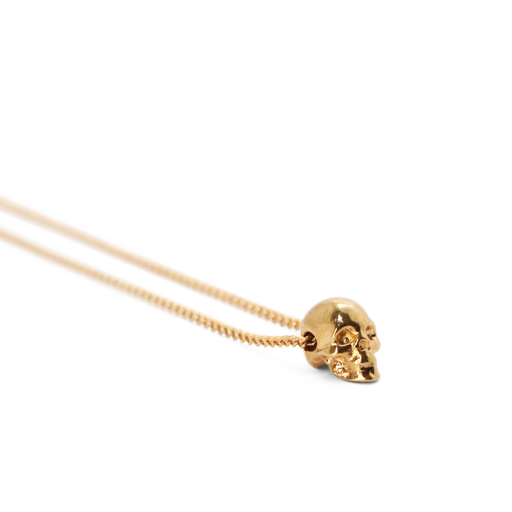 dije cráneo mini chapa de oro
