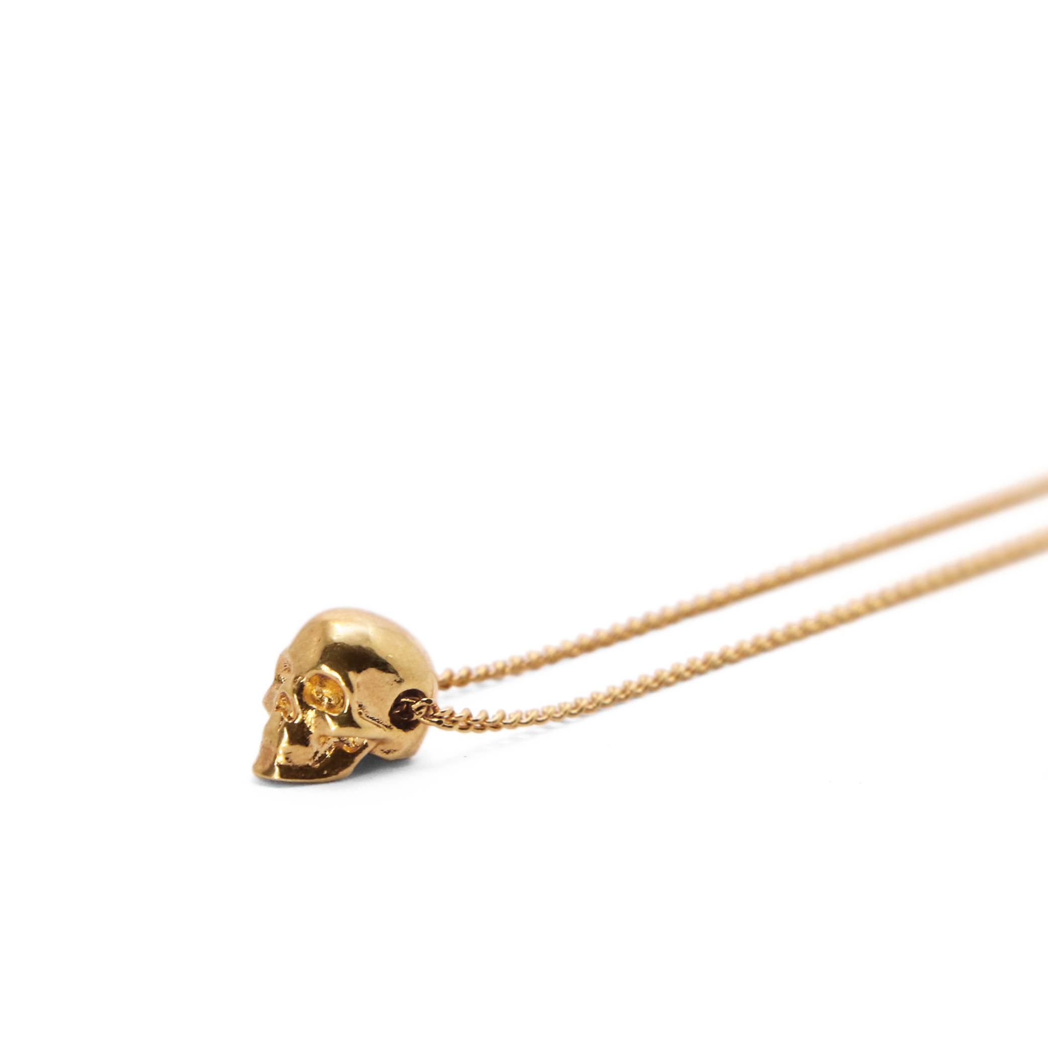 dije cráneo mini chapa de oro