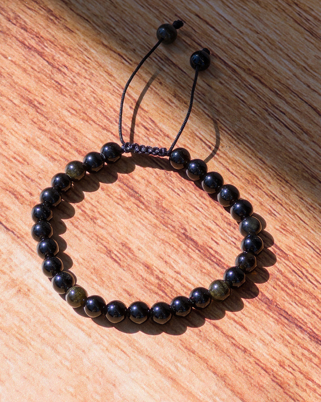 Pulsera ajustable obsidiana dorada 4mm