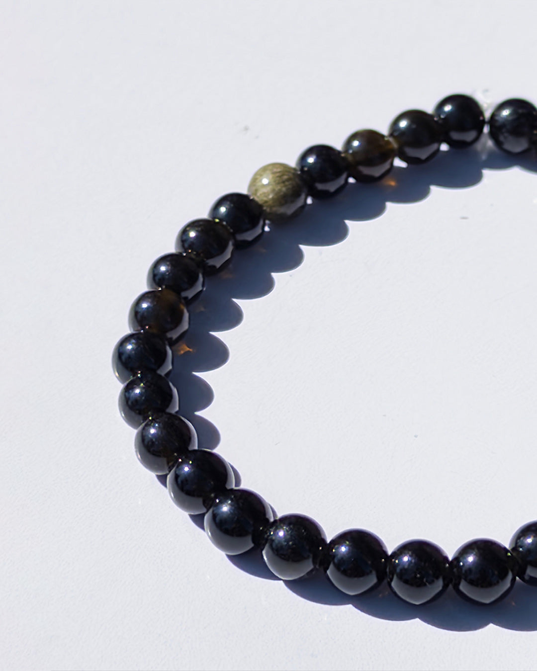 Pulsera obsidiana dorada 12mm