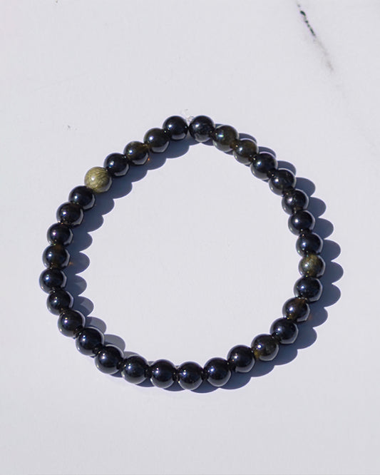 Pulsera obsidiana dorada 12mm