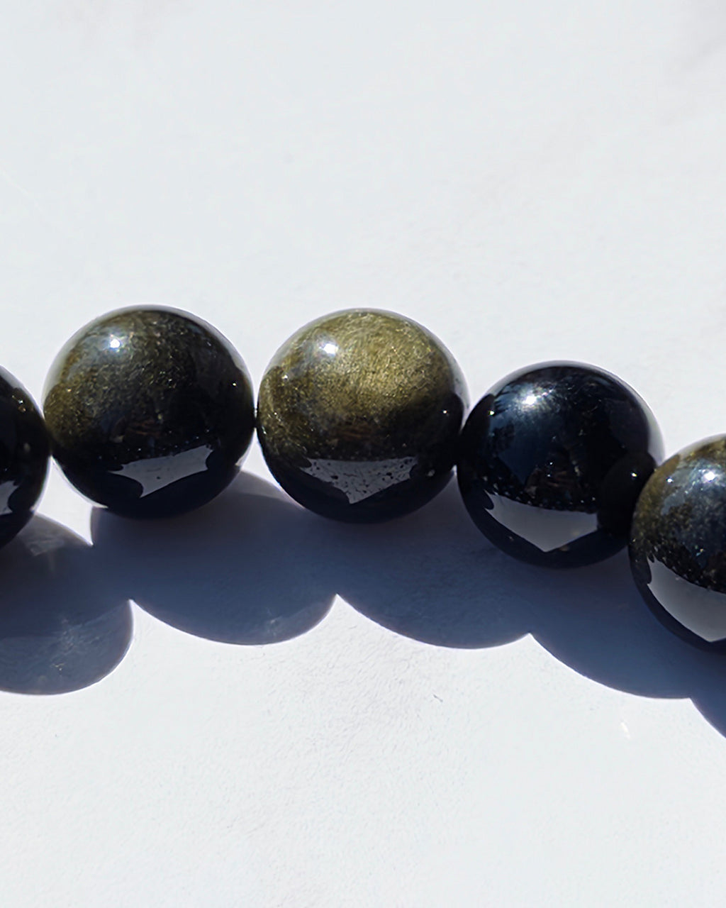 Pulsera obsidiana dorada 14mm