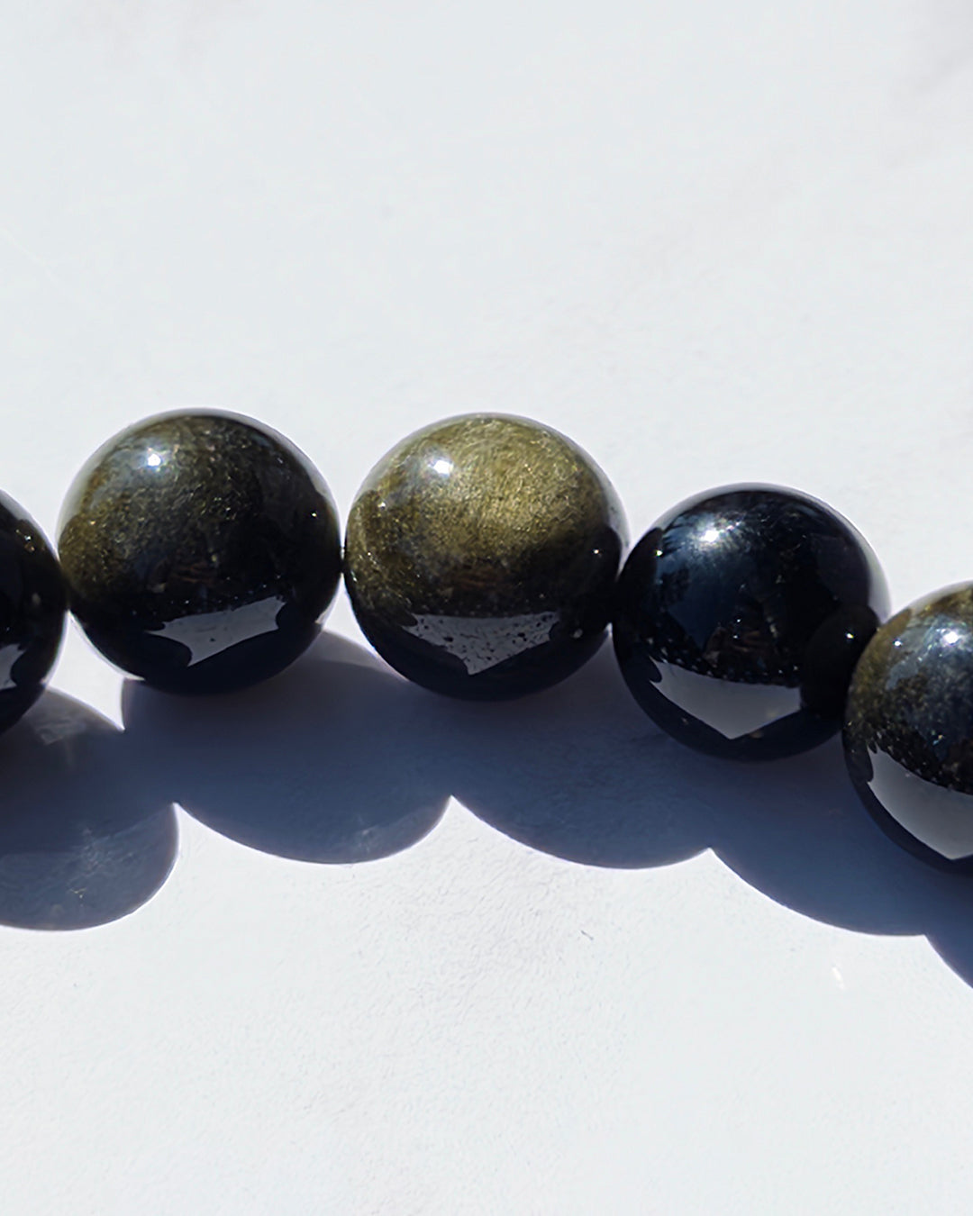 Pulsera obsidiana dorada 14mm