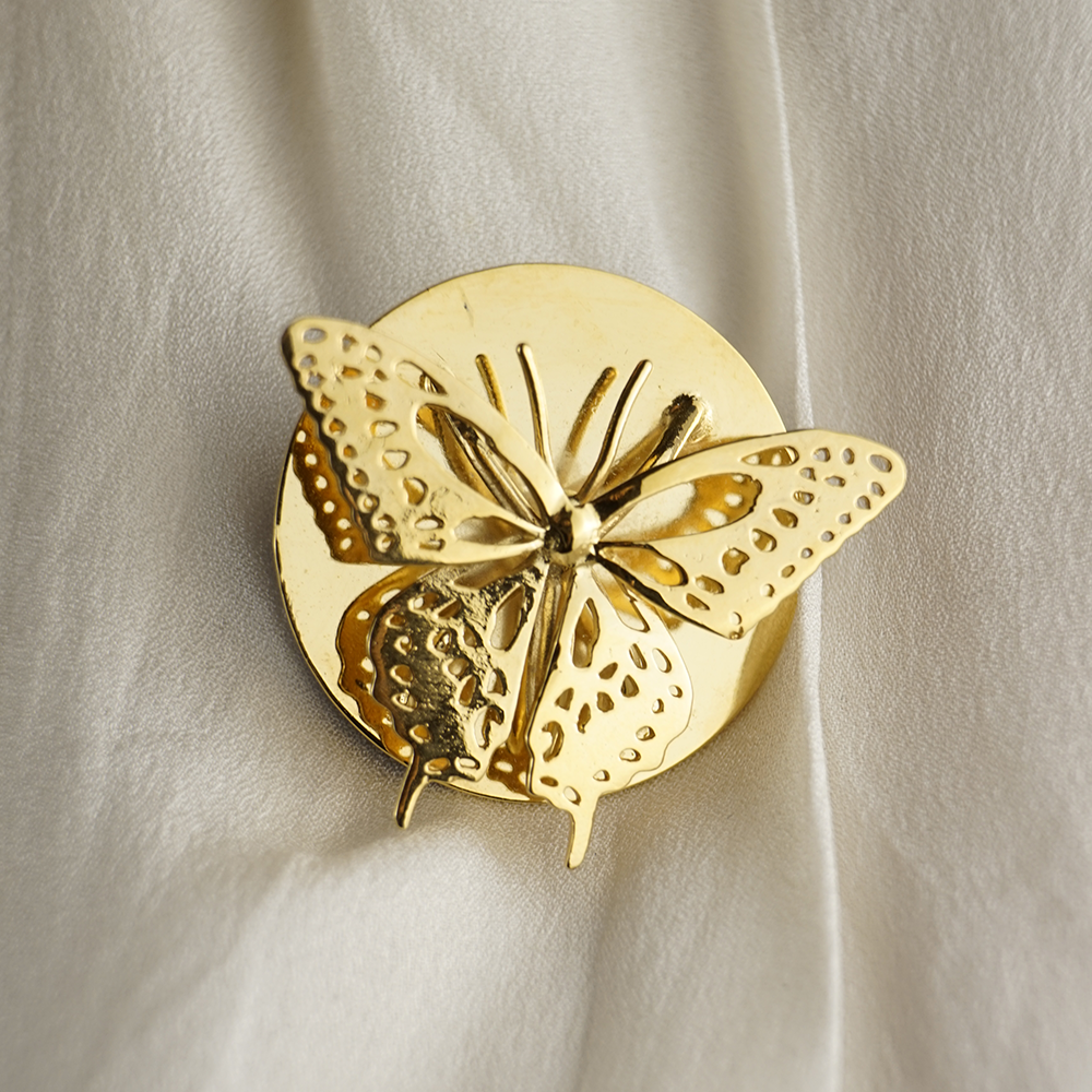 anillo y broche mariposa cola de golondrina