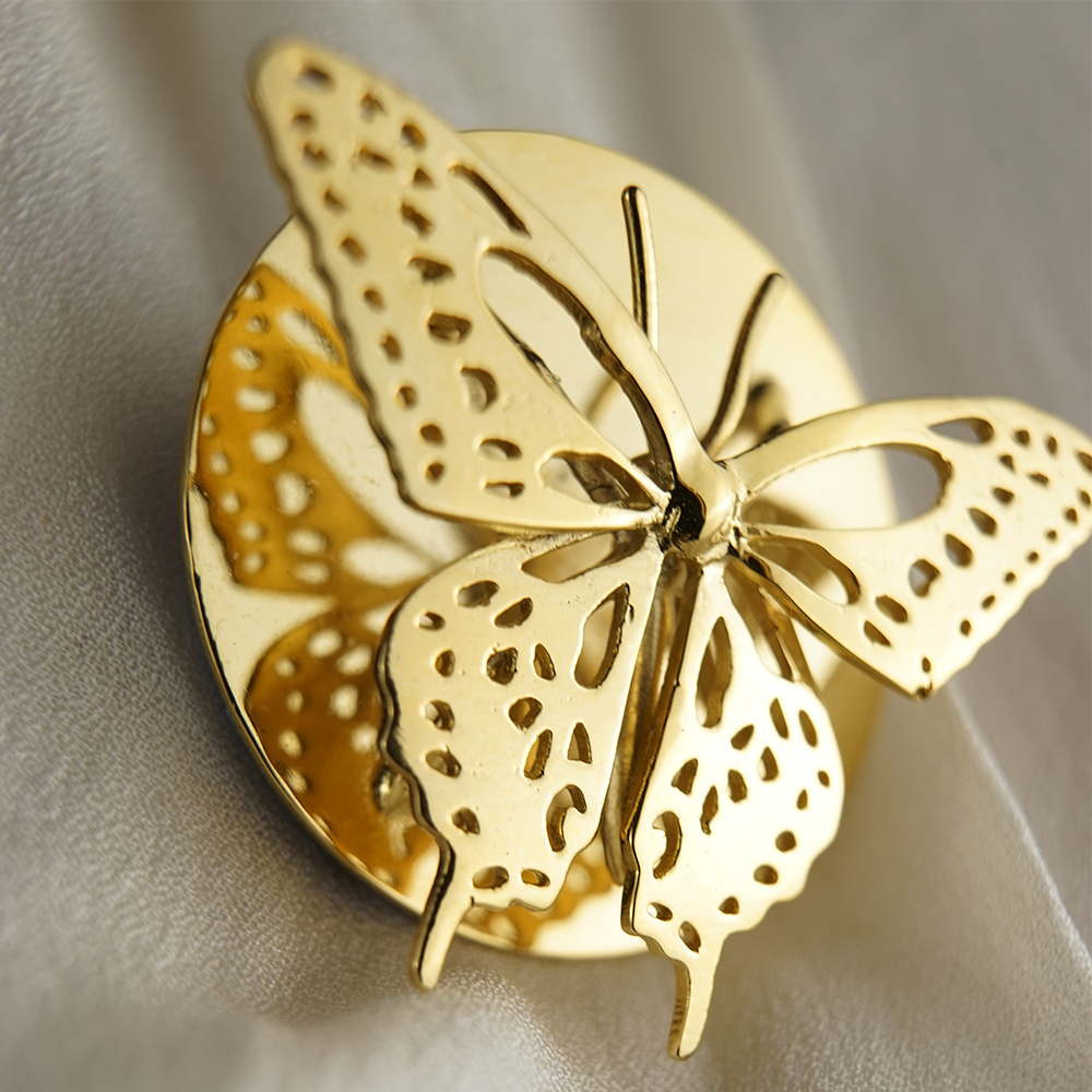anillo y broche mariposa cola de golondrina